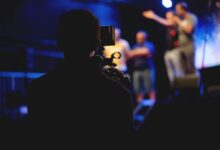 photographer and videographer in a studio