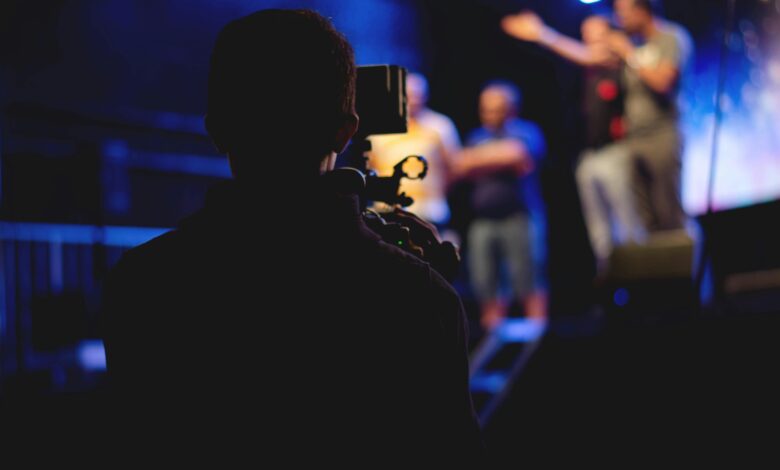 photographer and videographer in a studio