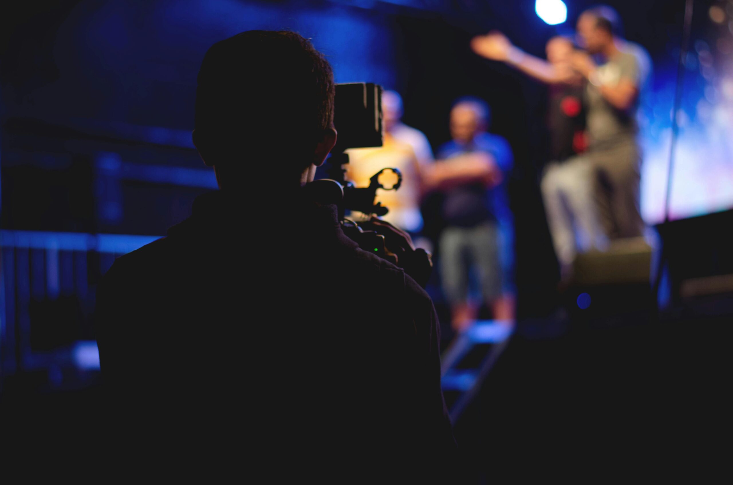 photographer and videographer in a studio